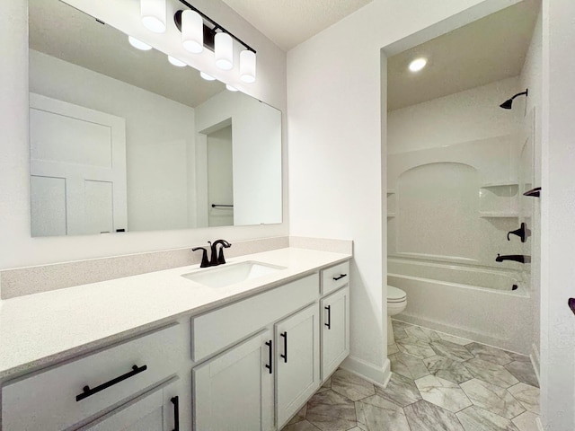 bathroom with marble look tiles, vanity, toilet, washtub / shower combination, and recessed lighting