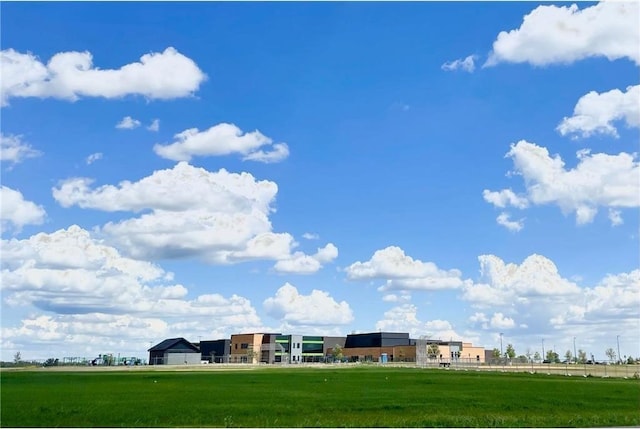 view of property's community with a lawn