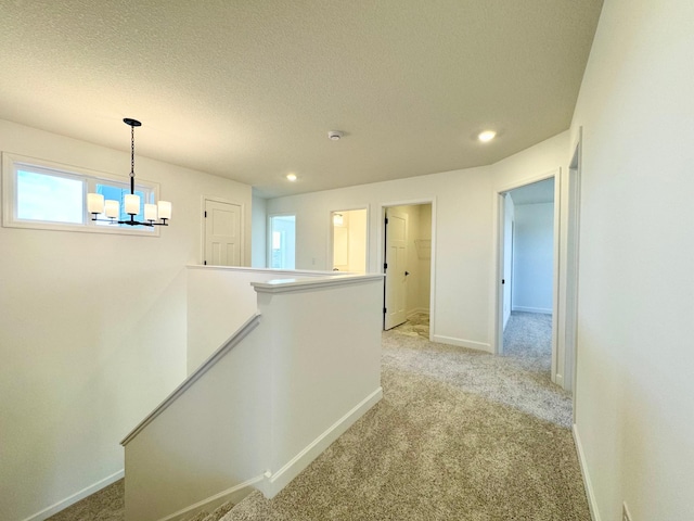 11367 84th St NE, Otsego, MN 55330 - hall with an upstairs landing, light colored carpet, recessed lighting, a textured ceiling, and baseboards