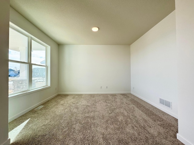 11367 84th St NE, Otsego, MN 55330 - empty room featuring carpet, baseboards, a textured ceiling, and recessed lighting