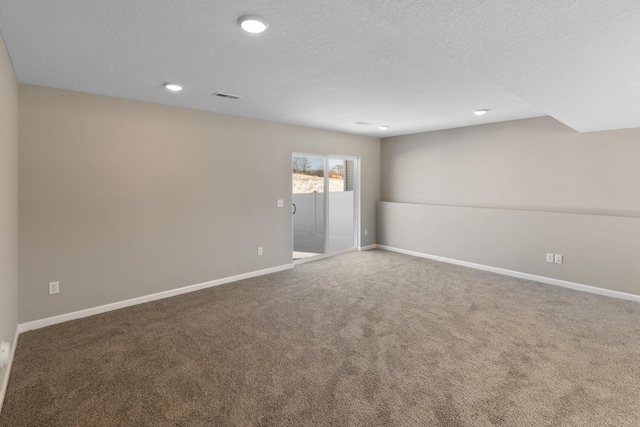 7497 147th Ln NW, Ramsey, MN 55303 - empty room featuring baseboards, carpet, recessed lighting, and a textured ceiling