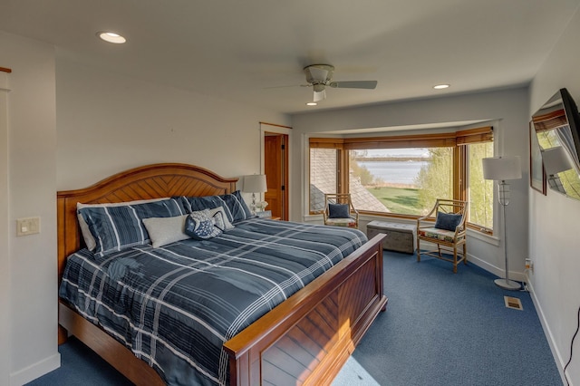 bedroom featuring dark carpet, baseboards, recessed lighting, and ceiling fan