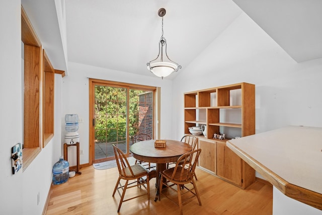 217 Canyon Dr, Hudson, WI 54016 - dining room featuring light wood-style floors and high vaulted ceiling