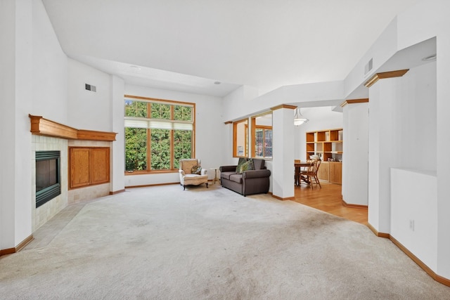 217 Canyon Dr, Hudson, WI 54016 - carpeted living area featuring baseboards and a fireplace