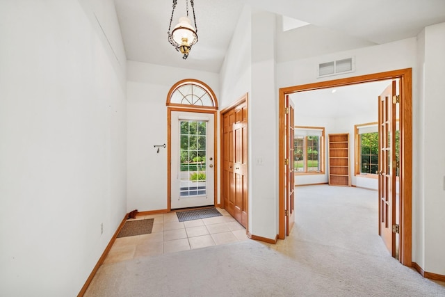 217 Canyon Dr, Hudson, WI 54016 - entrance foyer with plenty of natural light, light carpet, and a towering ceiling