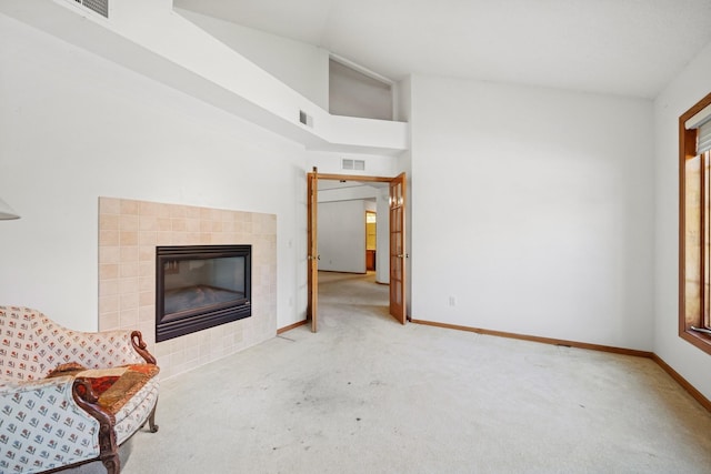 217 Canyon Dr, Hudson, WI 54016 - unfurnished living room with carpet flooring and a tiled fireplace