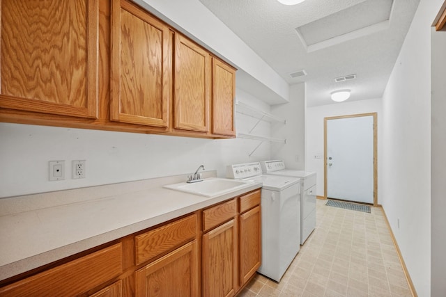 217 Canyon Dr, Hudson, WI 54016 - laundry room featuring independent washer and dryer, light floors, and cabinet space