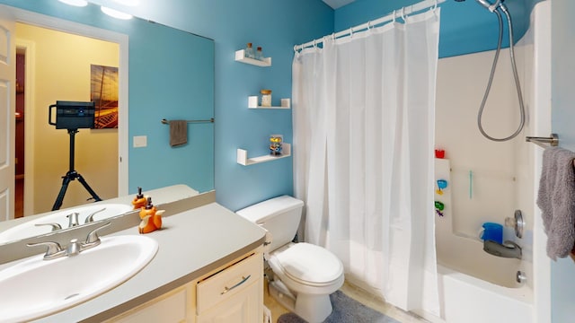 full bath featuring toilet, vanity, and shower / tub combo