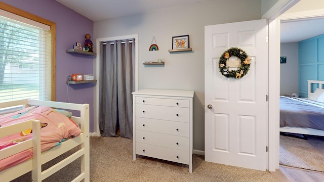 bedroom with light colored carpet