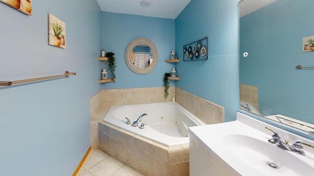 full bath with tile patterned floors, a tub with jets, and vanity