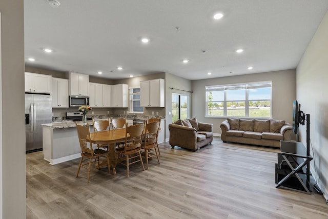 16386 Jaffna Pl, Lakeville, MN 55044 - dining space featuring recessed lighting, light wood-style flooring, and baseboards