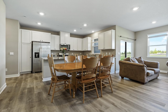 16386 Jaffna Pl, Lakeville, MN 55044 - dining room with wood finished floors, baseboards, and recessed lighting