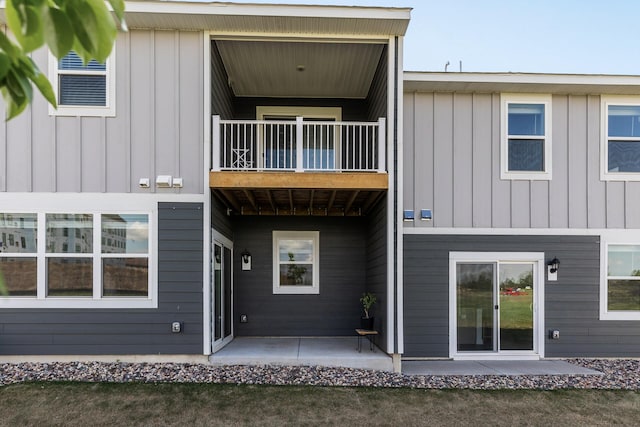 16386 Jaffna Pl, Lakeville, MN 55044 - back of property with a balcony and board and batten siding