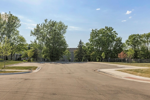 16386 Jaffna Pl, Lakeville, MN 55044 - view of asphalt road with sidewalks and curbs