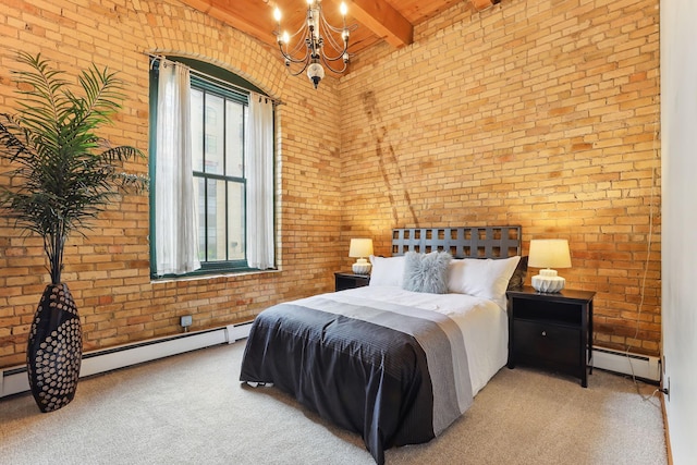 carpeted bedroom with brick wall, a baseboard heating unit, a chandelier, and beamed ceiling