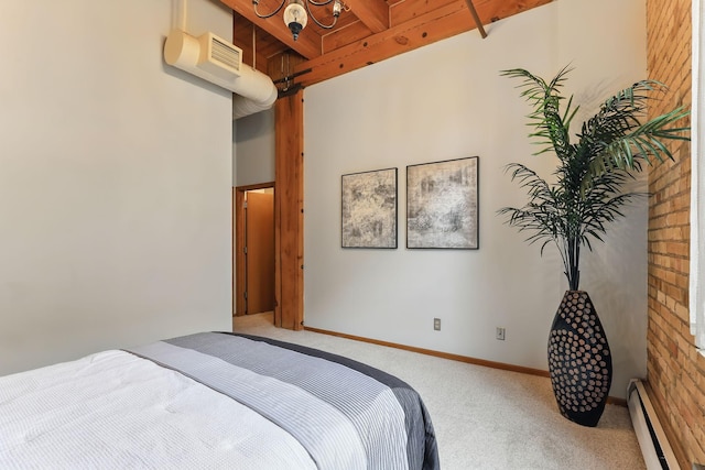 bedroom with a baseboard heating unit, carpet, and baseboards