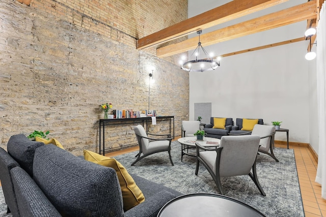 interior space featuring a high ceiling, a chandelier, and beam ceiling