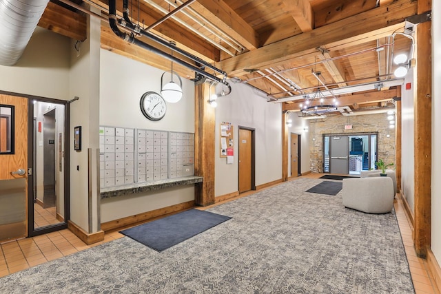 common area featuring wooden ceiling with exposed beams