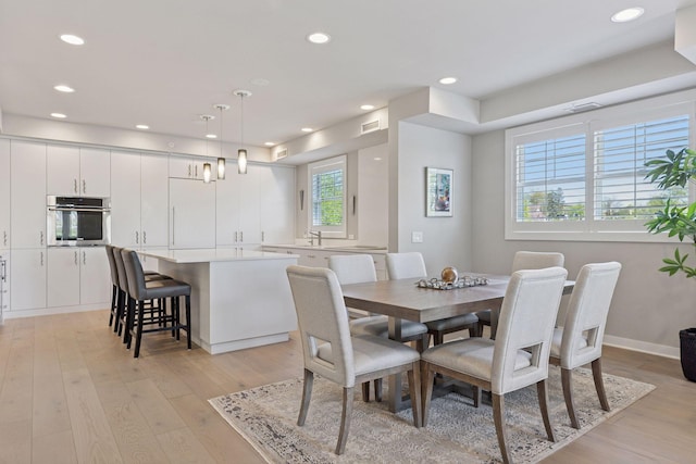 415 Indian Mound St Unit 302, Wayzata, MN 55391 - dining room featuring light wood-style flooring and recessed lighting