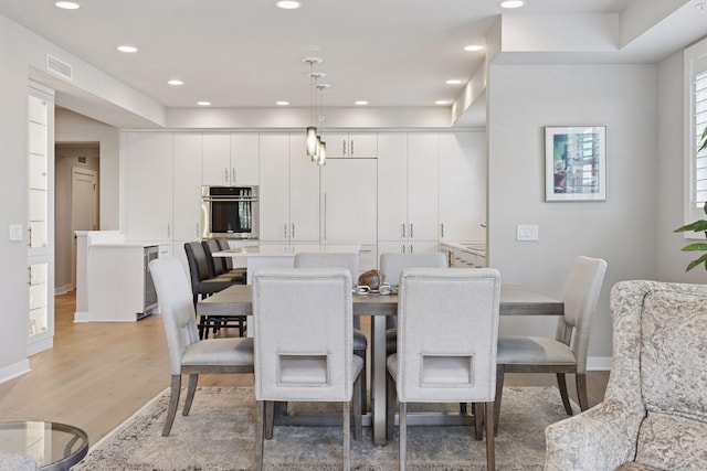 415 Indian Mound St Unit 302, Wayzata, MN 55391 - dining space with light wood-style flooring, baseboards, and recessed lighting