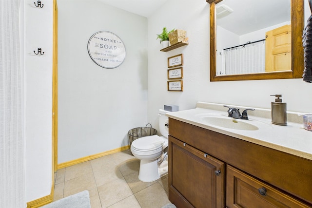 full bath with tile patterned floors, vanity, toilet, and baseboards
