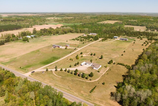 aerial view of property and surrounding area featuring rural landscape