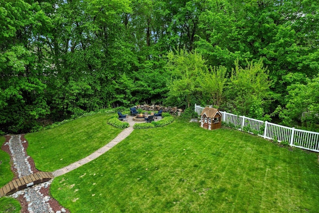 view of yard featuring an outdoor fire pit and a patio