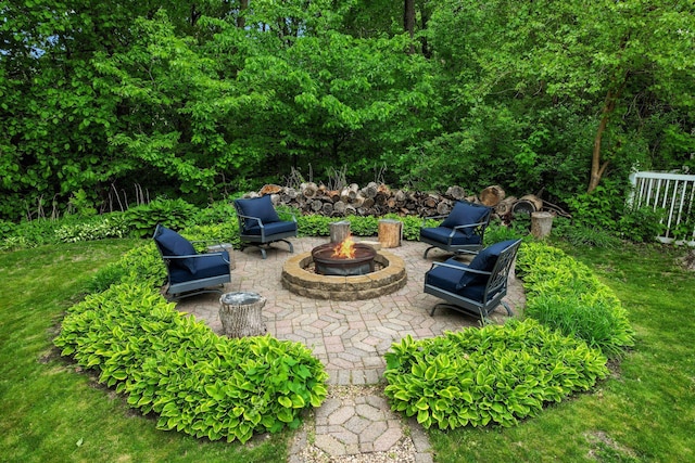 view of patio / terrace with an outdoor fire pit
