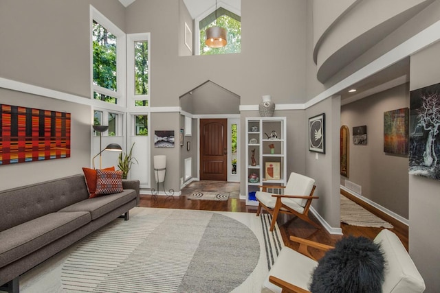 2 Edgcumbe Pl, Saint Paul, MN 55116 - living room with a towering ceiling, wood finished floors, and baseboards