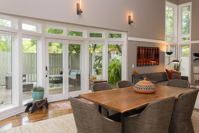 2 Edgcumbe Pl, Saint Paul, MN 55116 - dining space with healthy amount of natural light, wood finished floors, and a towering ceiling