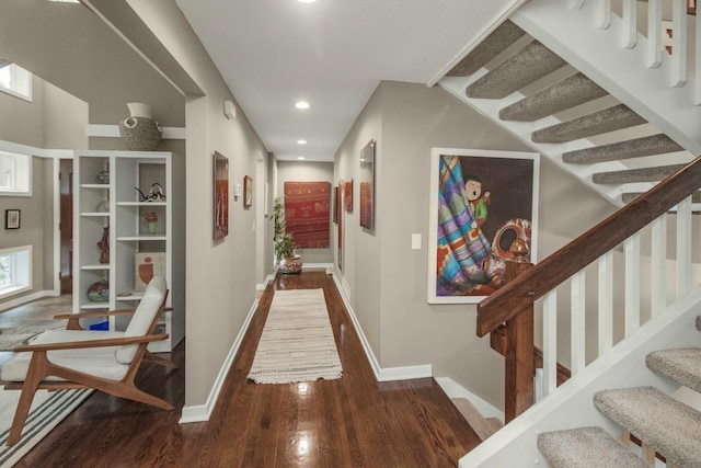 2 Edgcumbe Pl, Saint Paul, MN 55116 - hallway with wood finished floors, baseboards, stairway, and recessed lighting