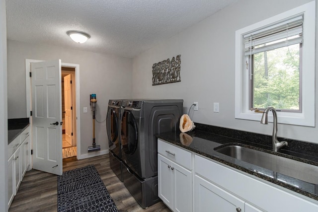 2 Edgcumbe Pl, Saint Paul, MN 55116 - laundry area with separate washer and dryer, dark wood-type flooring, a textured ceiling, and cabinet space