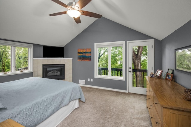 2 Edgcumbe Pl, Saint Paul, MN 55116 - bedroom featuring access to exterior, vaulted ceiling, a tiled fireplace, light carpet, and ceiling fan