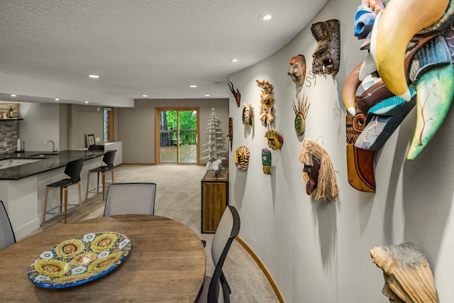 2 Edgcumbe Pl, Saint Paul, MN 55116 - dining space featuring wet bar, recessed lighting, light colored carpet, a textured ceiling, and baseboards