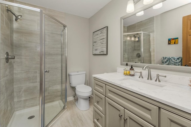2 Edgcumbe Pl, Saint Paul, MN 55116 - bathroom with vanity, a stall shower, and toilet