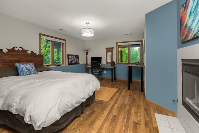 2 Edgcumbe Pl, Saint Paul, MN 55116 - bedroom with wood finished floors, baseboards, and an office area
