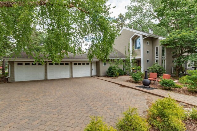 2 Edgcumbe Pl, Saint Paul, MN 55116 - view of front of property with decorative driveway and stucco siding