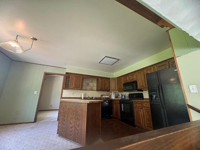 1725 Woodlawn Ave, Owatonna, MN 55060 - kitchen featuring black appliances, a sink, glass insert cabinets, baseboards, and dark carpet