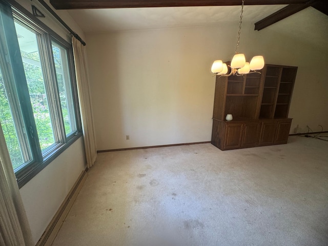 1725 Woodlawn Ave, Owatonna, MN 55060 - unfurnished dining area featuring healthy amount of natural light, light carpet, a chandelier, and baseboards