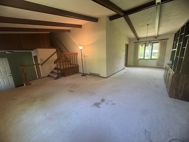 1725 Woodlawn Ave, Owatonna, MN 55060 - unfurnished living room featuring stairs, carpet flooring, and baseboards