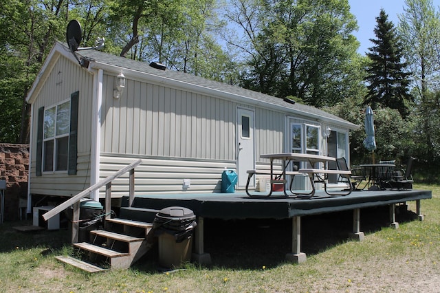 39624 Crane Lake Dr, Clitherall Twp, MN 56515 - back of house featuring roof with shingles and a wooden deck