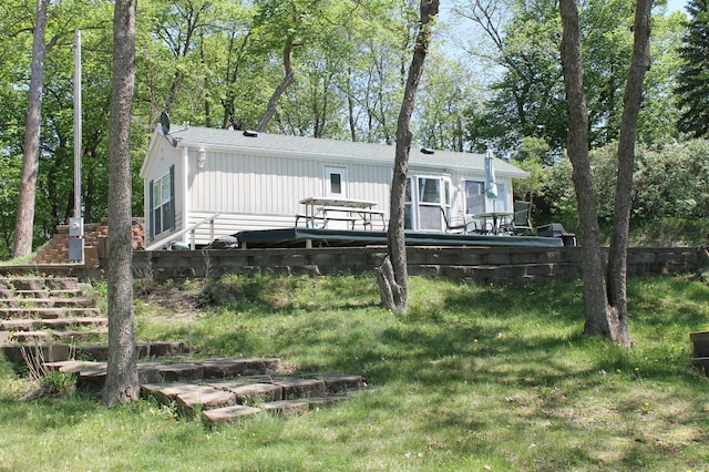 39624 Crane Lake Dr, Clitherall Twp, MN 56515 - back of property featuring stairs, a yard, and a wooden deck
