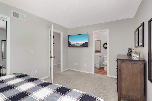 12037 Robin Rd, Maple Grove, MN 55369 - unfurnished bedroom featuring carpet flooring, baseboards, and connected bathroom