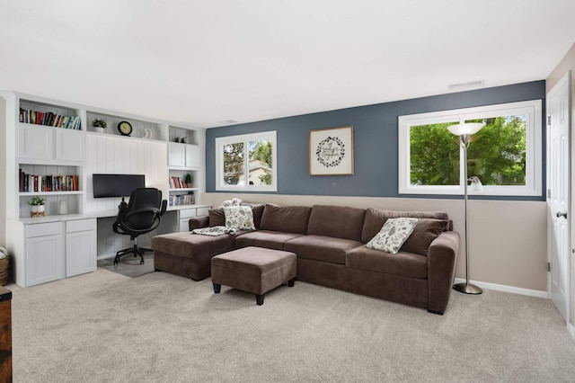 12037 Robin Rd, Maple Grove, MN 55369 - living room with an office area, light colored carpet, and baseboards