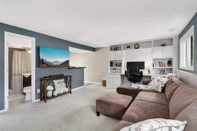 12037 Robin Rd, Maple Grove, MN 55369 - living room with light colored carpet, a desk, and baseboards