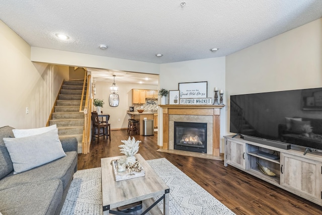 8289 Delaney Dr Unit 24, Inver Grove Heights, MN 55076 - living area featuring stairs, dark wood finished floors, a textured ceiling, a fireplace with flush hearth, and recessed lighting