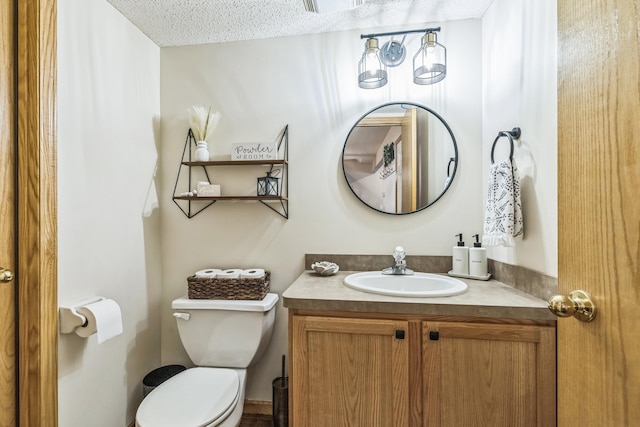 8289 Delaney Dr Unit 24, Inver Grove Heights, MN 55076 - bathroom featuring toilet, vanity, and a textured ceiling