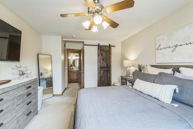 8289 Delaney Dr Unit 24, Inver Grove Heights, MN 55076 - bedroom with a barn door, light carpet, ceiling fan, and ensuite bath