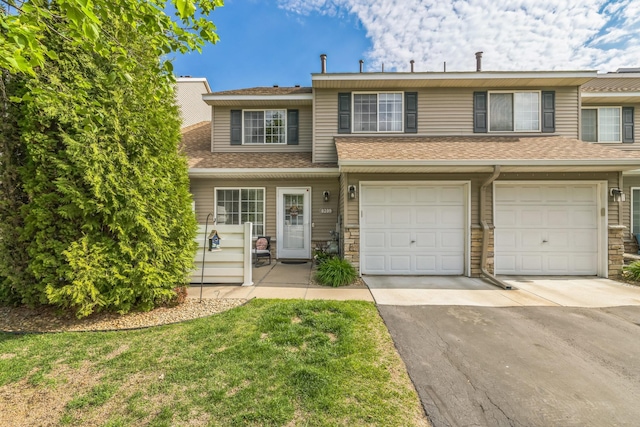 8289 Delaney Dr Unit 24, Inver Grove Heights, MN 55076 - multi unit property featuring driveway, a garage, and a shingled roof