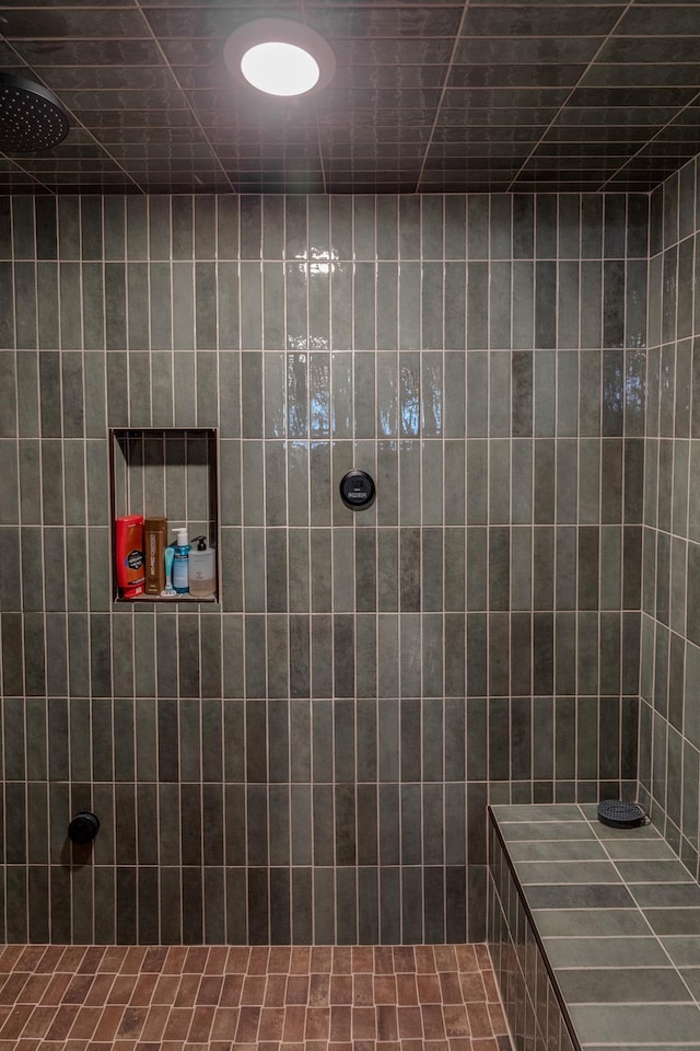 bathroom with a tile shower